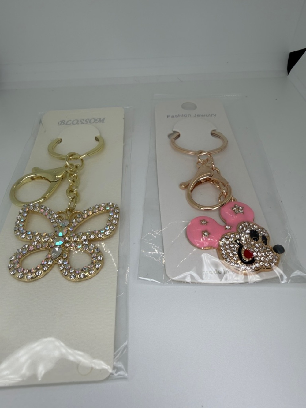 NWT Set 2 Keychains are bag, charms, butterfly, and Mickey Mouse  goldtone